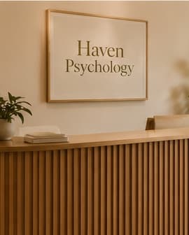 The Haven Psychology reception desk with a lounge area beyond